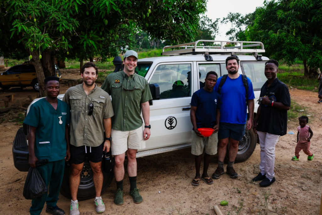 From right to left: Wilson, Nick, Luke, Unknown Village Member, Grady, Emmanuel. Our backdrop is the Aspen Collective Land Cruiser.