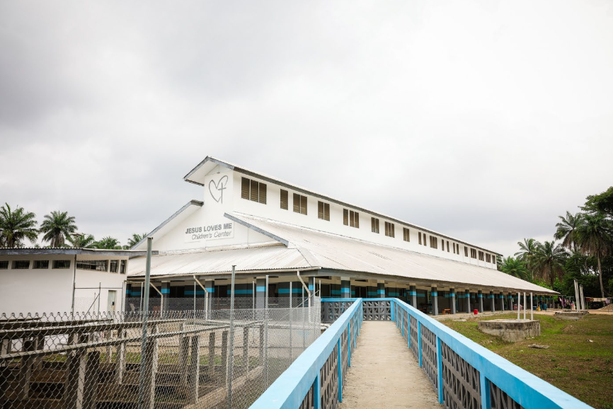 View of Jesus Loves Me Children’s Center. To the left you can see solar panels, which keeps the lifesaving hospital equipment (like oxygen machines) operating 24/7. Access to reliable power is challenging in this area, so the solar system is critical.