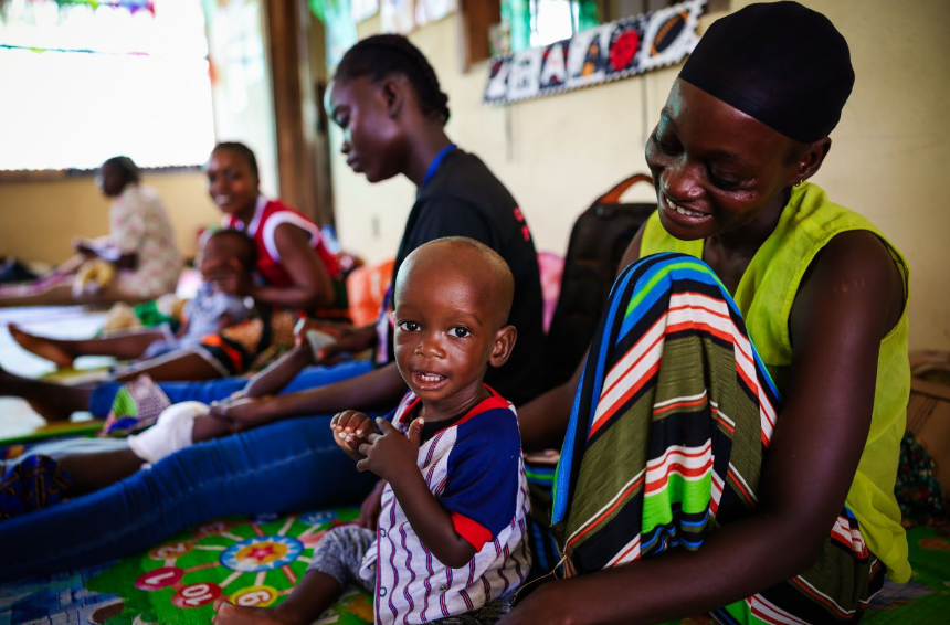 A child with cerebral palsy and his mother at “His Safe Haven”