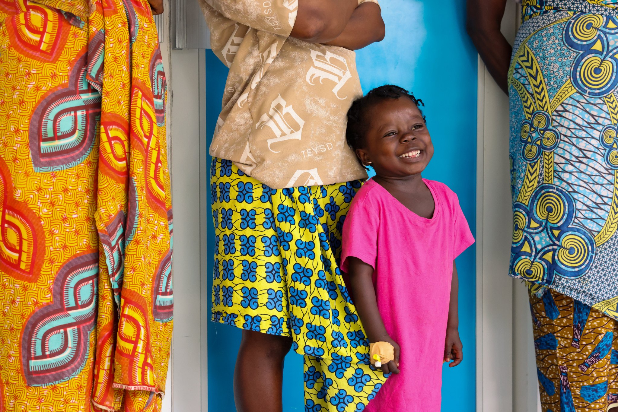 Two smiling children at the Jesus Loves Me Children's Center.
