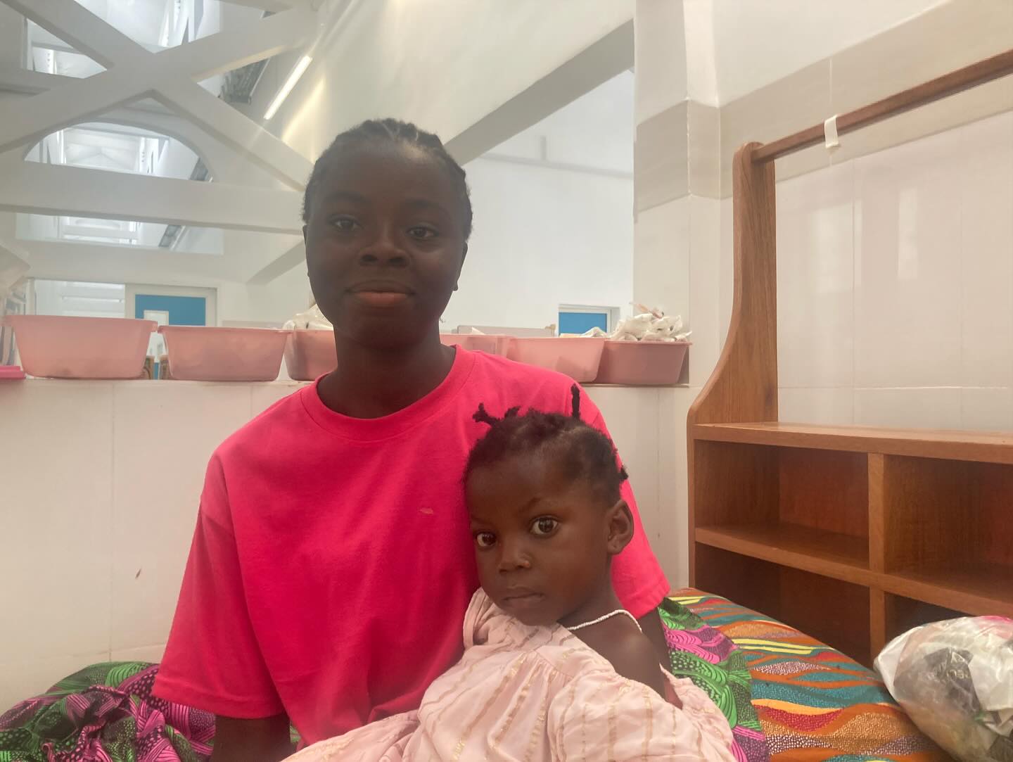 Rachel, recovered from cerebral malaria, with her mother at the Jesus Loves Me Children's Center